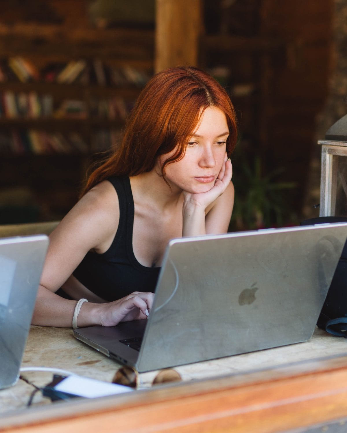 A freelancer working on her laptop in a café